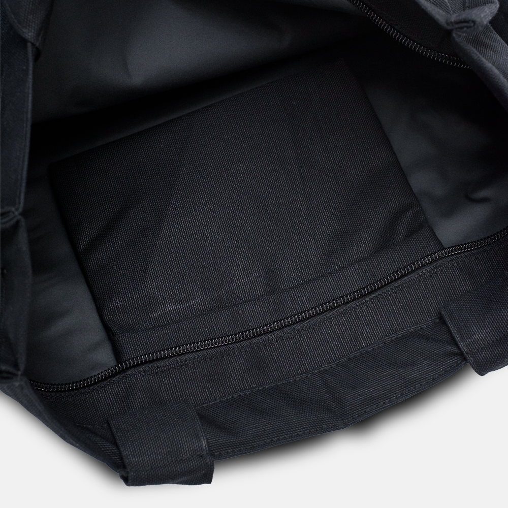 Close-up shot showing the inner pocket of the black tote bag.