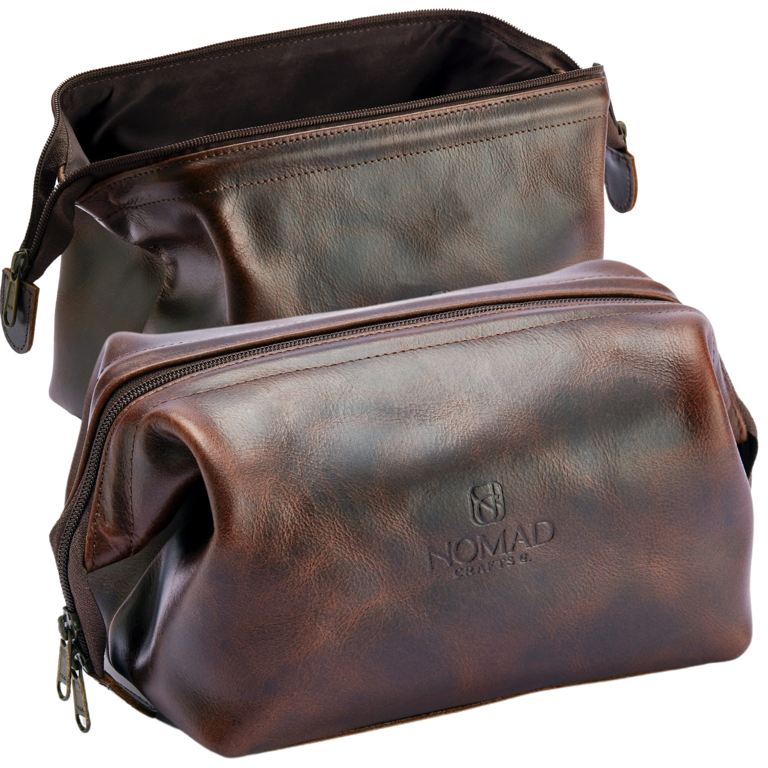 Two brown leather bags with 'Nomad' branding on a white background
